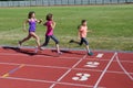 Family fitness, mother and kids running on stadium track, training and children sport healthy lifestyle Royalty Free Stock Photo