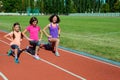 Family fitness, mother and kids training on stadium, sport with children