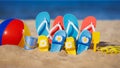 Family flip-flops, beach ball and snorkel on the sand. Summer vacation concept Royalty Free Stock Photo
