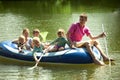 Family float on an inflatable boat and fish net.