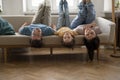 Family fooling around lying upside down on sofa Royalty Free Stock Photo