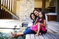 Family is forever. a mother with her two children dipping their feet into the pool on the patio. Royalty Free Stock Photo