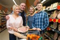 Family of four adults in the supermarket