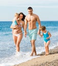 Family of four at the beach Royalty Free Stock Photo