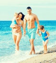 Family of four at the beach Royalty Free Stock Photo