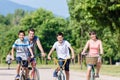 Family of four on bike tour in summer Royalty Free Stock Photo