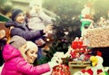 Family of four buying christmas decorations Royalty Free Stock Photo