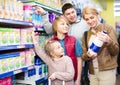 Family of four buying pasteurized milk