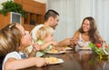 Family of four eating spaghetti