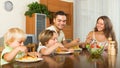 Family of four eating spaghetti