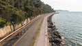 Family of four enjoying in together cycling near the sea, aerial shot Royalty Free Stock Photo