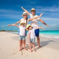 Family of four have fun on caribbean summer vacation Royalty Free Stock Photo