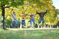 Family of four jumping in autumn park Royalty Free Stock Photo