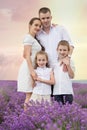 Family of four among lavender field