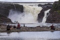 Family of four and other people enjoying the view of the impressive 115-foot tall ChaudiÃÂ¨re River Falls