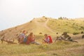 Family of four people eating fastfood in mountains Royalty Free Stock Photo