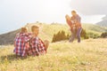 Family of four people looking to beautiful seascape in mountains