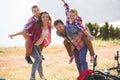 Family of four people riding bikes in the mountains Royalty Free Stock Photo