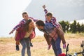 Family of four people riding bikes in the mountains Royalty Free Stock Photo