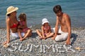 Family from four persons has rest on beach Royalty Free Stock Photo