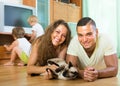 Family of four playing with kitten Royalty Free Stock Photo