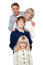 Family of four posing in a row Royalty Free Stock Photo