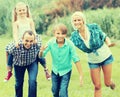 Family of four resting at countryside Royalty Free Stock Photo