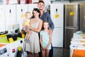 Family of four shopping in household hypermarket