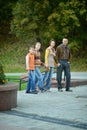 Family of four walking in autumn park Royalty Free Stock Photo