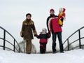 Family of four on winter bridge Royalty Free Stock Photo