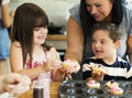 Family with fresh homemade cupcakes