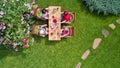 Family and friends eating together outdoors on summer garden party. Aerial view of table with food and drinks from above Royalty Free Stock Photo