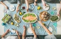 Family or friends having seafood summer dinner