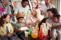 Family and friends singing a birthday song to a little celebrant at his birthday party at home. Family, celebration, together Royalty Free Stock Photo