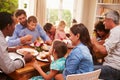 Family and friends sitting at a dining table Royalty Free Stock Photo