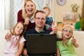 Family in front of computer having video conferenc
