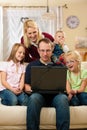 Family in front of computer having video conferenc