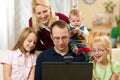 Family in front of computer having video conferenc