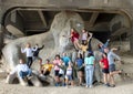 Family fun on The Fremont Troll, under the north end of the George Washington Memorial Bridge in Seattle, Washington. Royalty Free Stock Photo