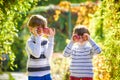 Family fun during harvest time on a farm. Kids playing in autumn Royalty Free Stock Photo