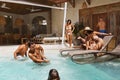 Family Fun In Pool. Group Of Happy People Splashing Water And Enjoying Leisure On Weekend. Royalty Free Stock Photo