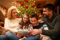 Family time on Christmas at home with digital tablet Royalty Free Stock Photo