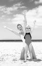 Happy young mother and daughter on seashore rejoicing Royalty Free Stock Photo