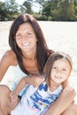 Family fun on white sand Portrait of smiling mother and daughter on sand beach sunny