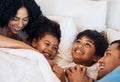 Family, funny and children laughing in bed at home in the morning together with their happy parents. Relax, love or Royalty Free Stock Photo