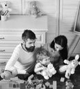 Family games concept. Kid boy, mother and father play builders in nursery Royalty Free Stock Photo