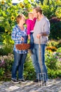 Family gardening, standing with fork in garden Royalty Free Stock Photo