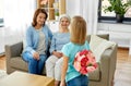 Grandmother, mother and daughter with flowers Royalty Free Stock Photo