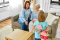 Grandmother, mother and daughter with flowers Royalty Free Stock Photo