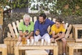 Family generations men with grandfather father and son nephew from old to young stay together using cellular technology smartphone